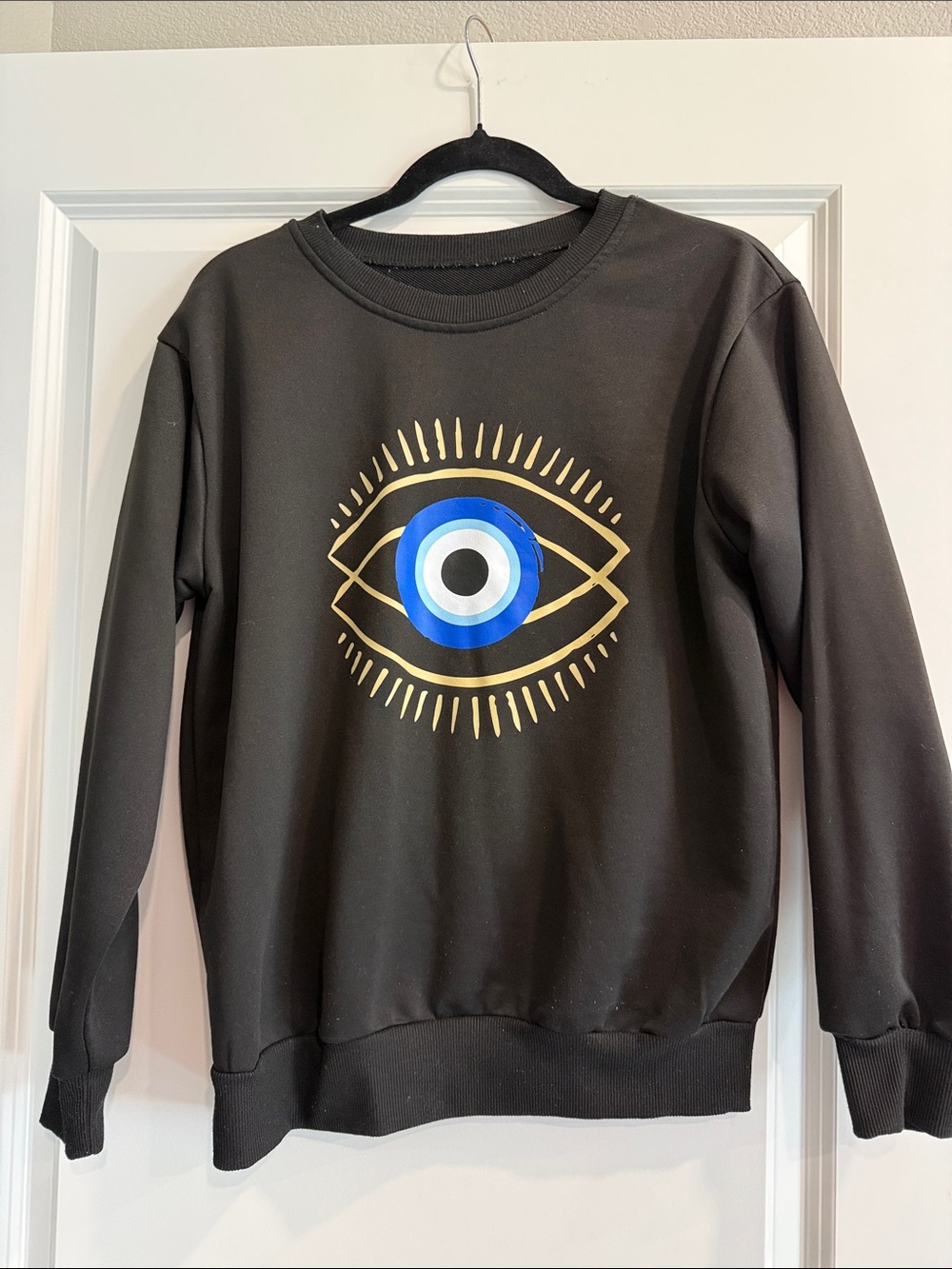 Black Graphic Sweatshirt with Gold & Blue Eye Motif sz s